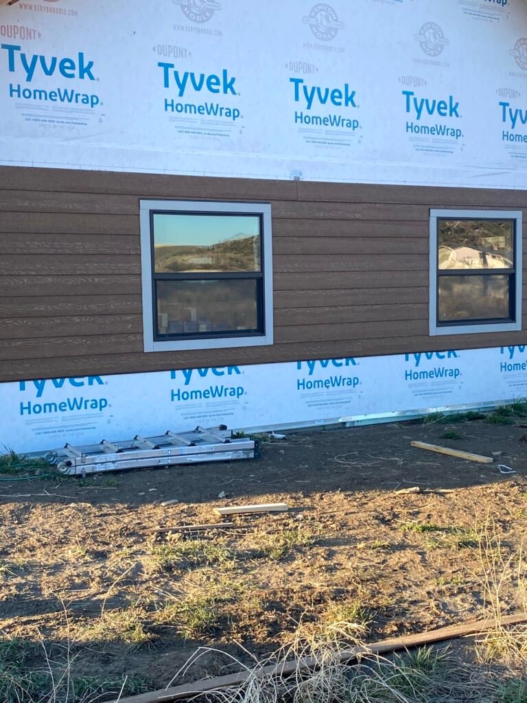 Home exterior siding being installed on a Montana home by a construction contractor